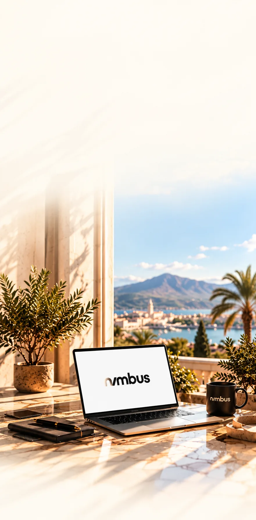 Laptop showing the Nimbus name on a terrace with a view of the sea