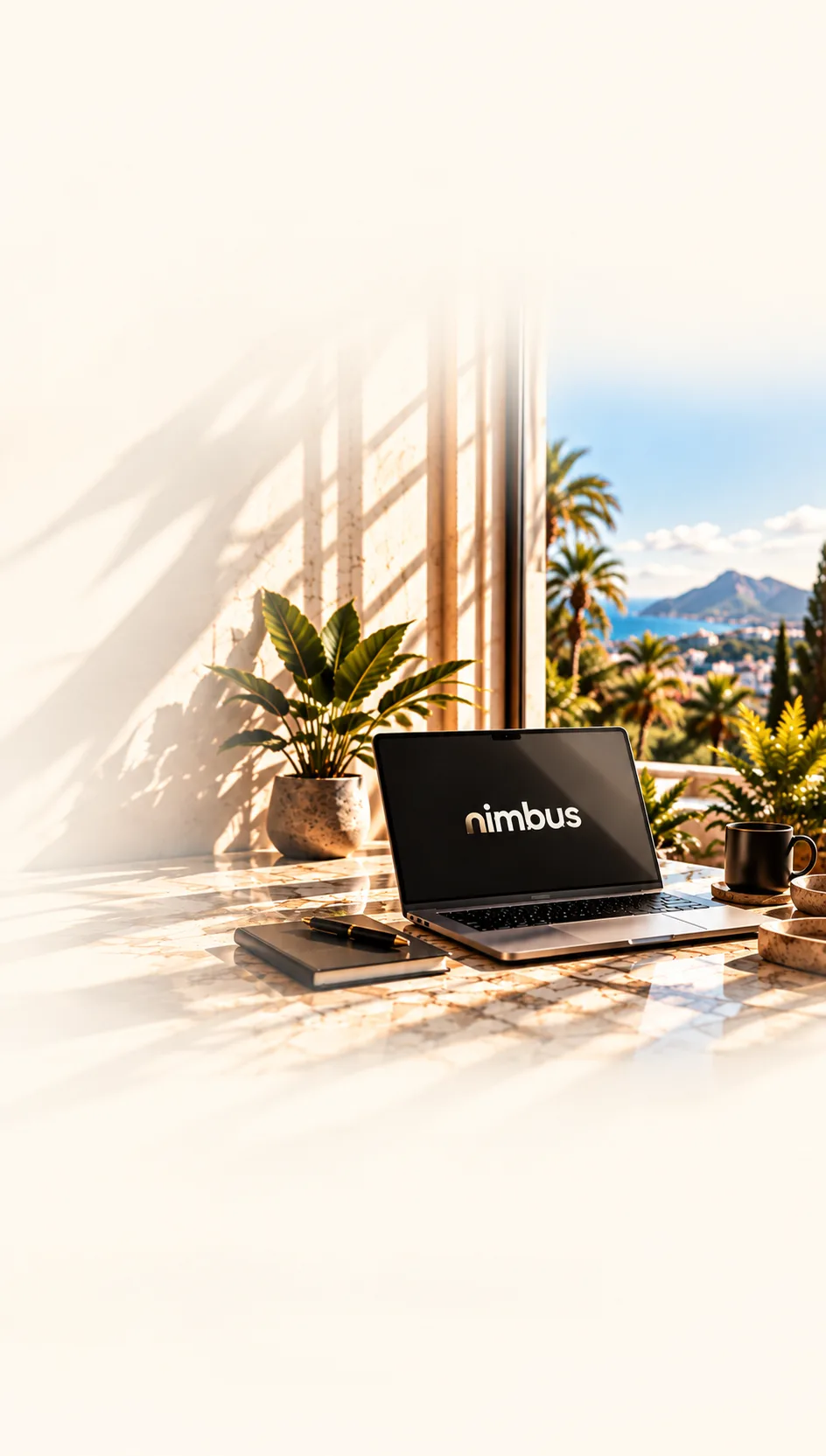 Laptop showing the Nimbus name on a marble desk with a view of the sea