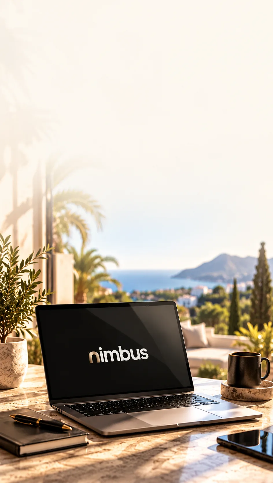 Laptop met de naam Nimbus op een terras met uitzicht op zee